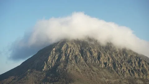Streaming summit or mountain massif on both sides, air flows meet and form a Stock-Footage 236838206