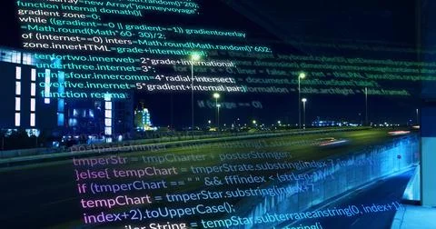 Streaming translucent code overlay hovering above highway at night, showing 库存照片