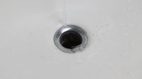 Streaming water in bathroom sink Stock Footage 150042624