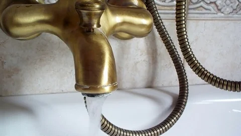 Streaming water from classic tap of the bath Stock Footage 80533217