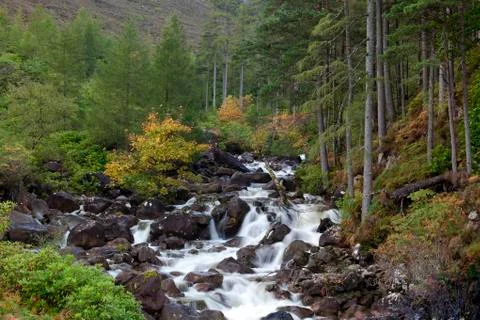 Streaming water down a mountain range Stock Photos