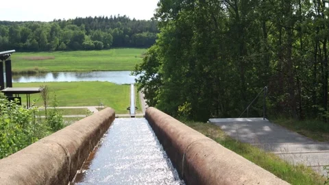 Streaming water at a small aqueduct Stock Footage 250476387