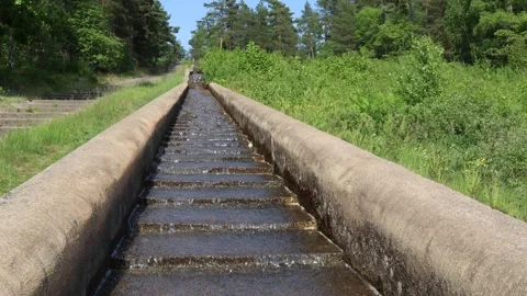 Streaming water at a small aqueduct. Stock Footage 250476410