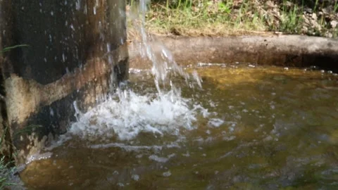 Streaming water at a small aqueduct. Stock Footage 250476433
