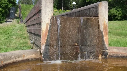 Streaming water at a small aqueduct. Stock Footage 250476440