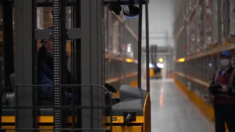 Streamline your warehouse operations with our reliable forklift. Stock Footage 242656110