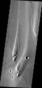 The streamlined islands in this image from NASA s Mars Odyssey are located... Stock Photos