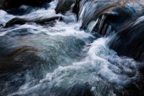 Streams in a cold wild river Stock Photos