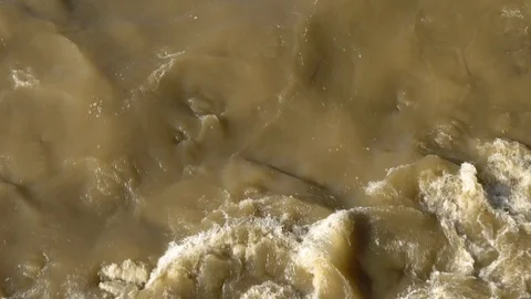 Streams of dirty grey river after a storm Stock Footage 96174275