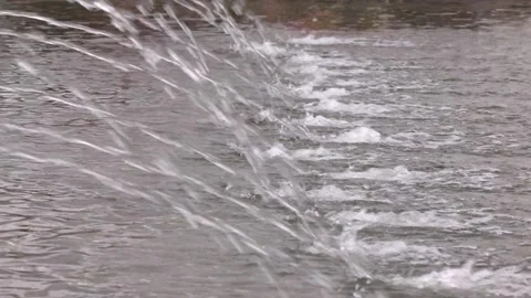 Streams flowing out of stainless grate. 스톡 동영상 314963034