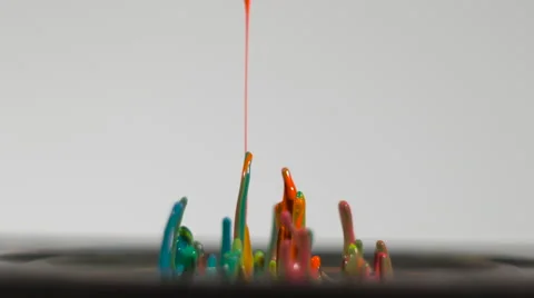 Streams of rainbow paint splash in slow motion and blend, isolated on white Stock Footage 63900727