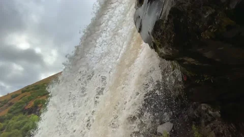 Streams of stormy water from the falls fall down Stock Footage 140576974
