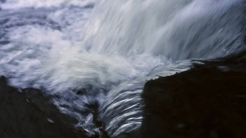Streams of water flow over the rocks Stock Footage 107424487