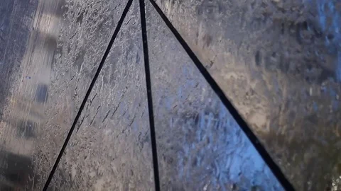 Streams of water run along the mirror surfaces of the wall. SLOW MOTION. HD Stock Footage 77747027
