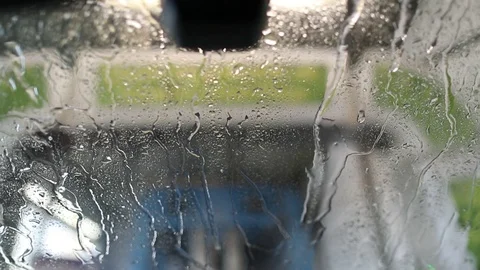 Streams of water on the windshield of the mash in the car wash Stock Footage 129709753