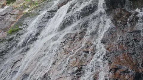 Streams of waterfall over a stone bed Stock Footage 331428521