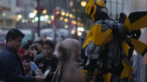 Street artist as transformer in Bandung Java Indonesia Stock Footage 81918454
