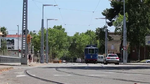 Street with a blue tram Stock Footage 69100536