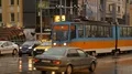 Street with busy traffic, tram running in middle of road, public transportation HD Footage