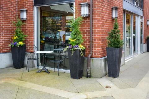 Street caffe for two with marble table and chairs as a small outdoor cafe Stock Photos