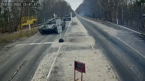 The street camera captures Russian troops invading Ukraine on February 24, 2022 Stock Footage 246007501
