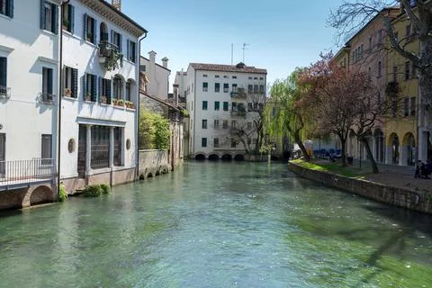 Street with canals like Venice, but less populated. Treviso, Italy. Stock Photos