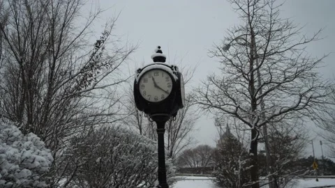 Street clock covered in snow . winter snow Video stock 171379246