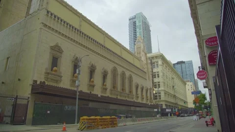 Street on a cloudy day with views of the Tower Theater Downtown Los Angele Stock Footage 154294257