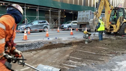 Street Construction Crew Using Machines: Power Broom, Dirt Compactor &amp; Tractor Stock Footage 85614910
