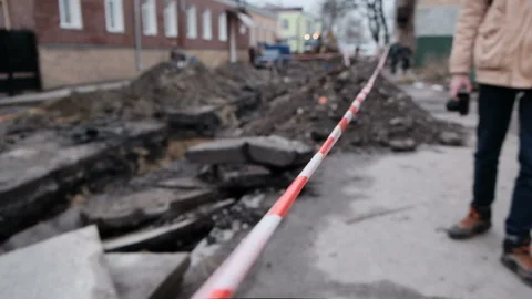 A street in construction is pending for workers building machines. Stock Footage 162464078