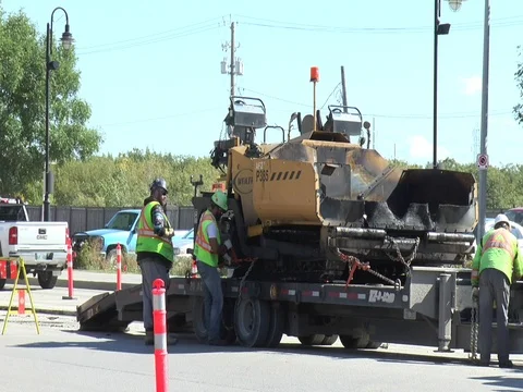 Street Construction Workers unload Asphalt Layer 스톡 동영상 81180474