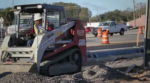 Street construction zone with skid loader Video stock 21880720