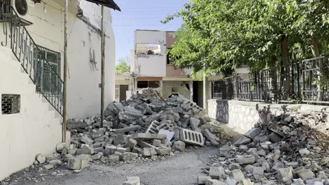A street covered with rubble Stock Footage 246397912