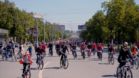 The street is crowded with cyclists of different ages. Stock Footage 108897060