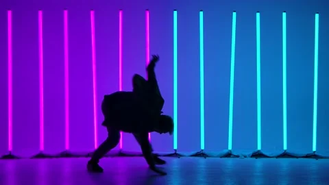 Street dance breakdance with acrobatic elements. A stylish man performs a Stock Footage 144421155