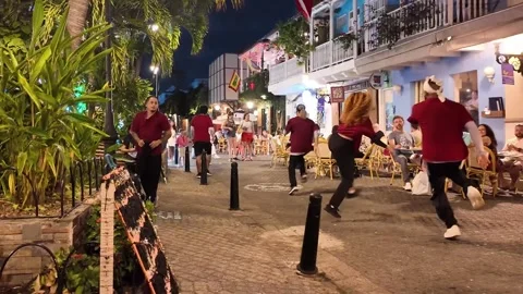 Street Dance Group Performing Choreography Beside Outdoor Restaurant Terrace at Stock Footage 340299688
