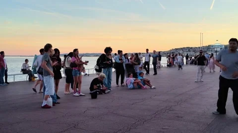 Street dancer performing breakdance for crowd on Nice promenade Stock Footage 336923231
