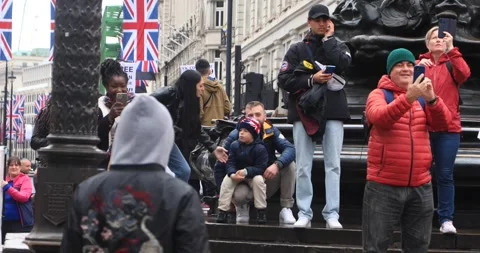 Street dancer performing for crowd at Piccadilly Circus, London Stock Footage 321017229