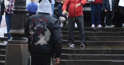 Street dancer performing for crowd at Piccadilly Circus, London Stock Footage 321017247