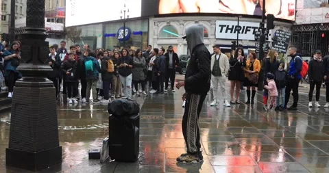 Street dancer performing for crowd at Piccadilly Circus, London Stock Footage 321017265