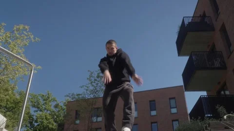A street dancer performs dynamic freestyle, blending various street dance styles Stock Footage 286877090
