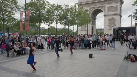 Street dancers perform acrobatic breakdance moves for a large crowd of people Stock Footage 336724433