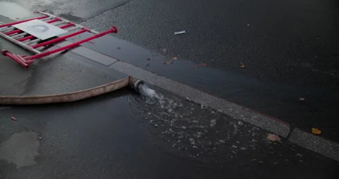 Street with fire hose Stock Footage 318073606