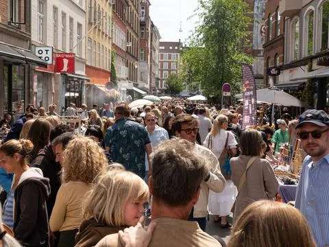 Street with flea market full of crowd of people. Stock Photos