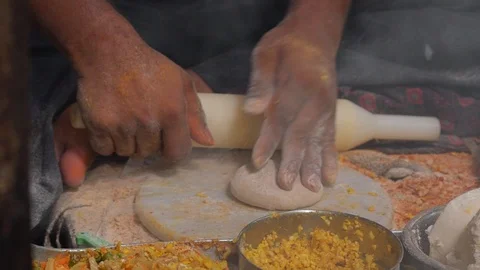 Street food market in india - hands preparing spicy dough with rolling pin Stock Footage
