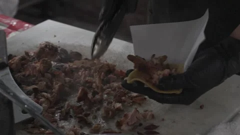 Street food tacos cook preparing the tortilla with chicken Stock Footage 297242853