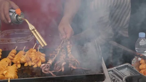 Street food vendor chef is grilling Stock Video Pond5