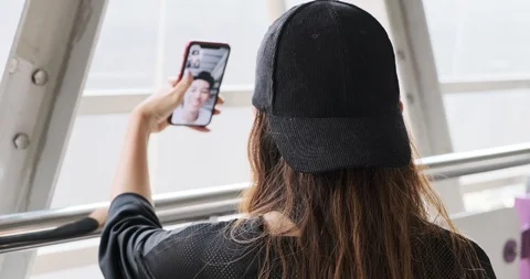 Street kid face time using mobile phone with his boyfriend in overpass. Asian Stock Footage 106382810