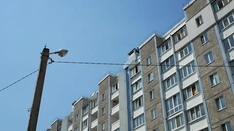 Street lamp against the background of a multi-storey residential building Stock Footage 133787961