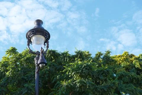 Street lamp with security camera attached. City infrastructure, lighting, safety 스톡 사진